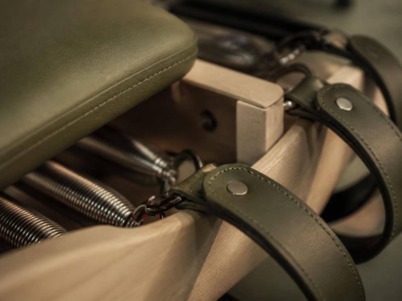 Close detail of reformer springs, straps and timber frame
